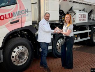 The UK Concrete Show's Charlotte Shacklock presents the New Product Award to Volumech's general manager Steve Cartwright.